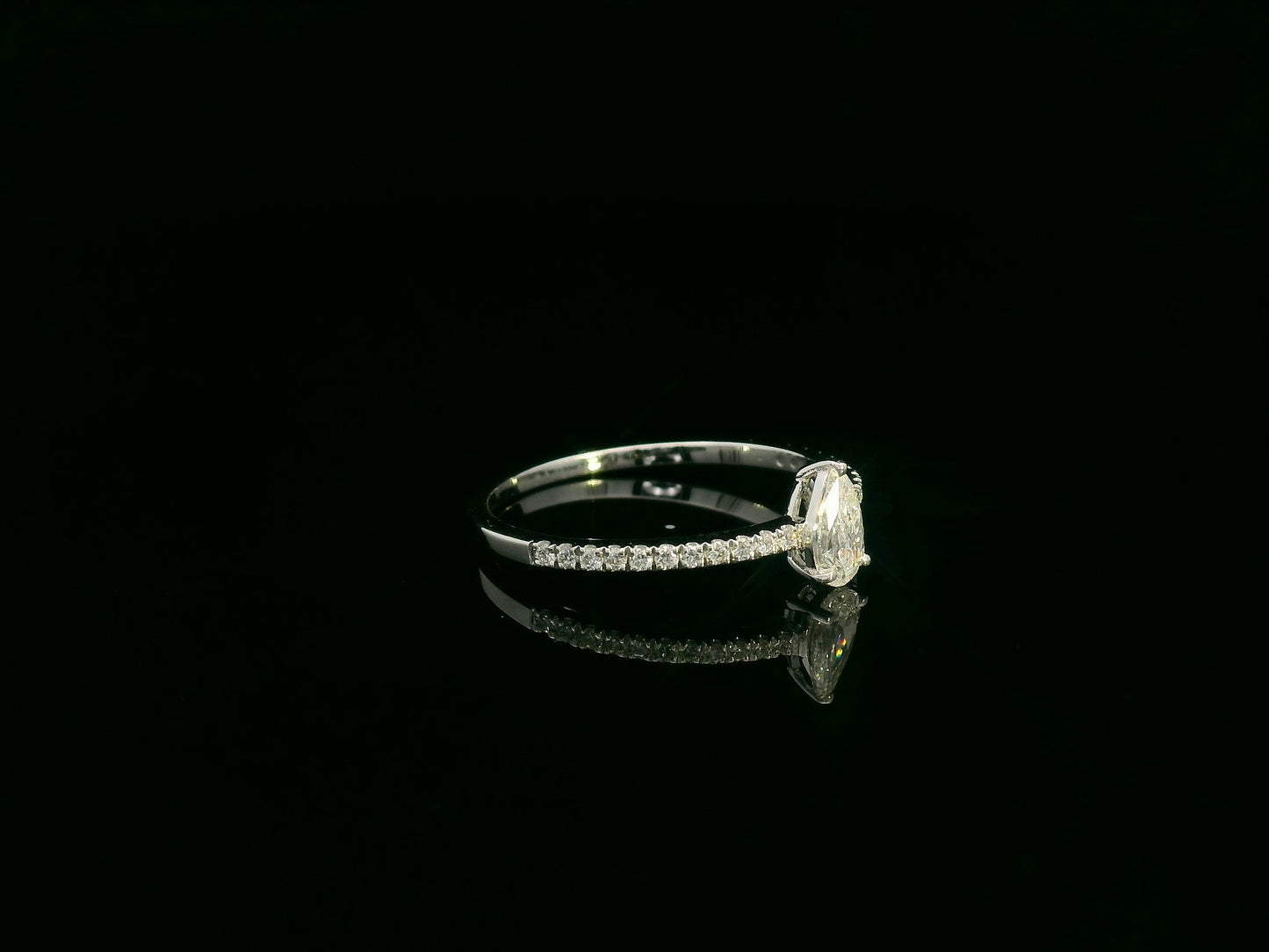 18K white gold pear-shaped diamond ring with pavé band by Emirates Diamonds