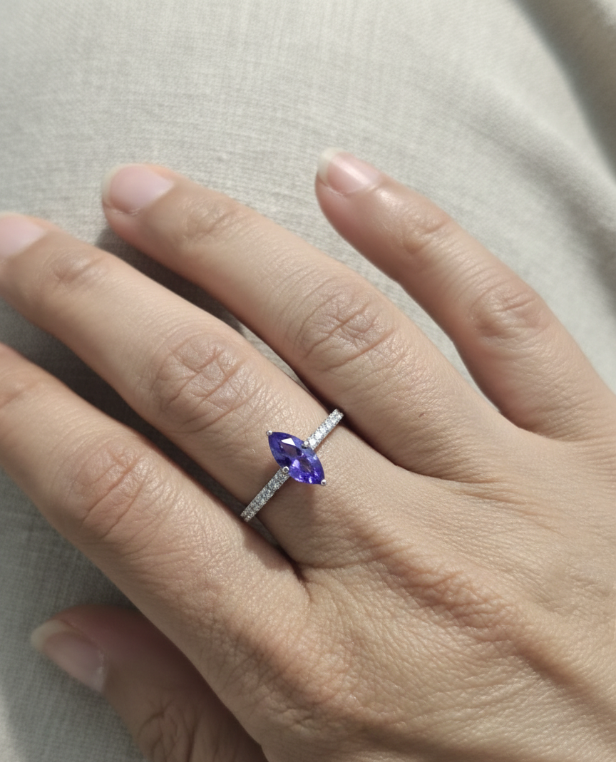18K white gold marquise-cut tanzanite ring with diamond halo and pavé band by Emirates Diamonds
