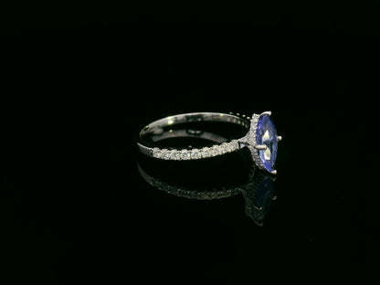18K white gold marquise-cut tanzanite ring with diamond halo and pavé band by Emirates Diamonds