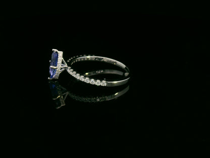18K white gold marquise-cut tanzanite ring with diamond halo and pavé band by Emirates Diamonds