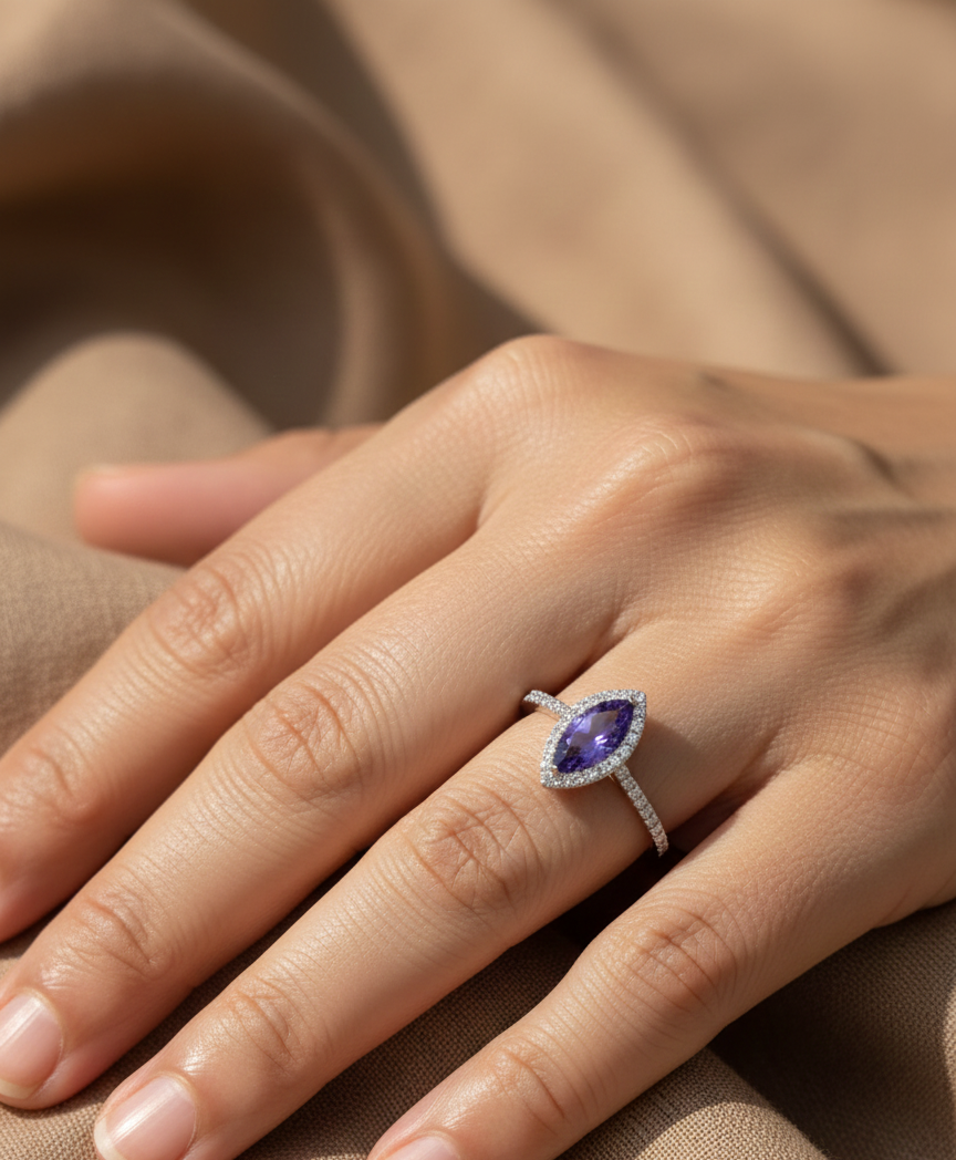18K white gold marquise-cut tanzanite ring with diamond halo and pavé band by Emirates Diamonds