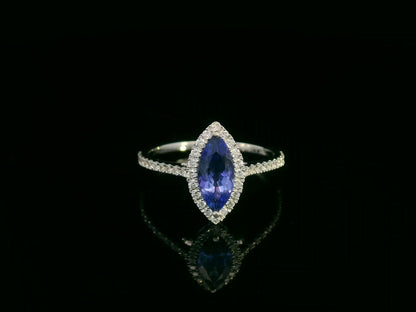 18K white gold marquise-cut tanzanite ring with diamond halo and pavé band by Emirates Diamonds
