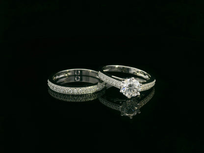 18K white gold diamond bridal ring set featuring a 1.01 carat GIA-certified round-cut center diamond with pavé diamond engagement ring and matching wedding band by Emirates Diamonds