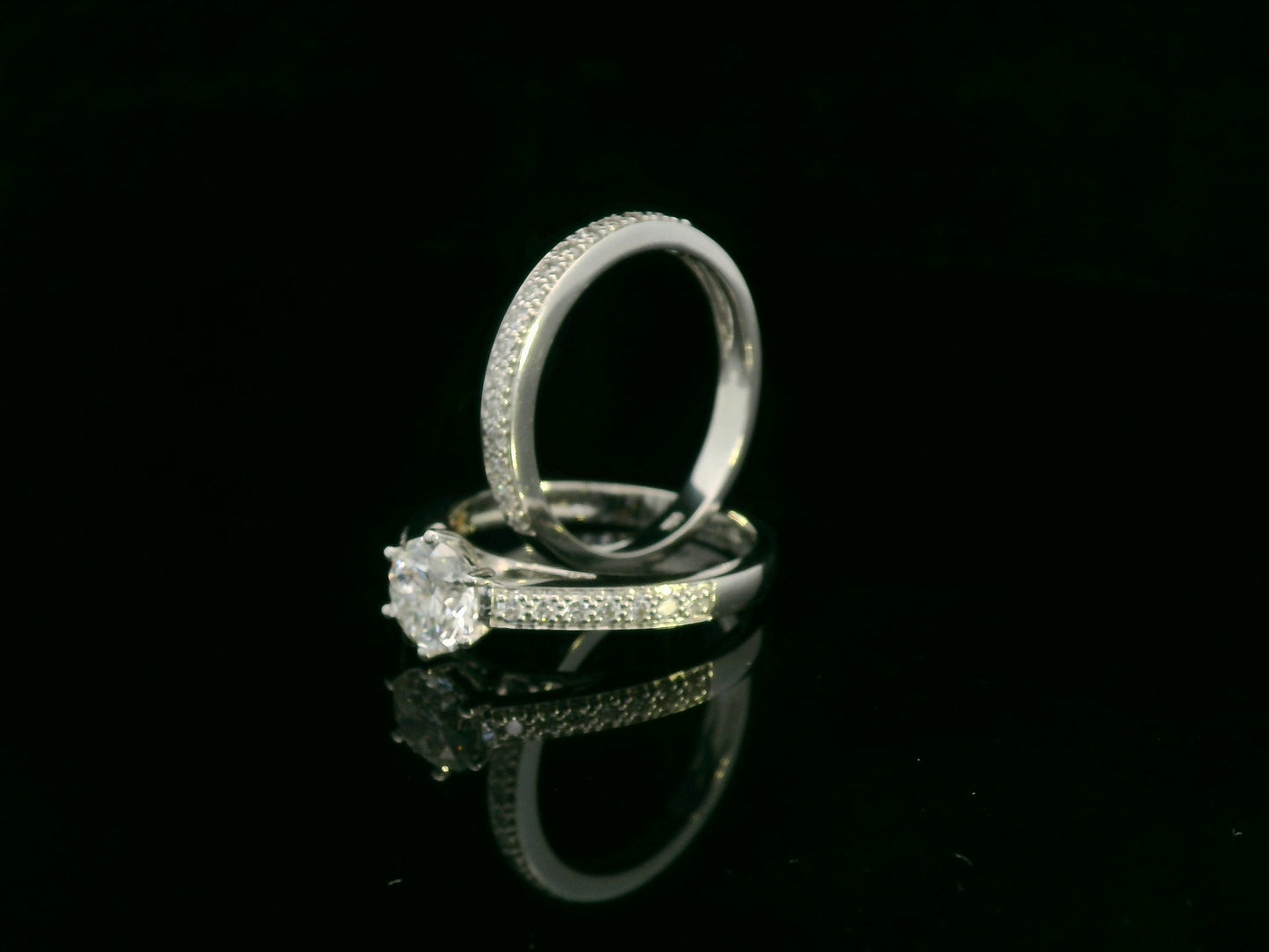 18K white gold diamond bridal ring set featuring a 1.01 carat GIA-certified round-cut center diamond with pavé diamond engagement ring and matching wedding band by Emirates Diamonds