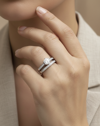 18K white gold diamond bridal ring set featuring a 1.01 carat GIA-certified round-cut center diamond with pavé diamond engagement ring and matching wedding band by Emirates Diamonds