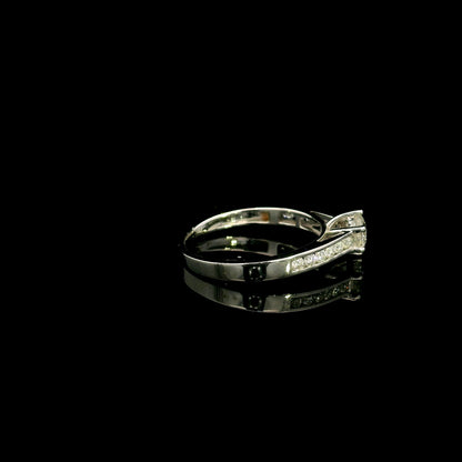 18K white gold engagement ring featuring a 0.60 carat GIA certified natural round brilliant diamond with F color and SI2 clarity, accented by 0.25 carat natural round diamonds on the shoulders in a classic six-prong setting.