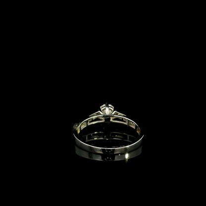 18K white gold engagement ring featuring a 0.60 carat GIA certified natural round brilliant diamond with F color and SI2 clarity, accented by 0.25 carat natural round diamonds on the shoulders in a classic six-prong setting.