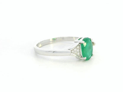 Oval emerald ring in 18K white gold with subtle diamond accents by Emirates Diamonds