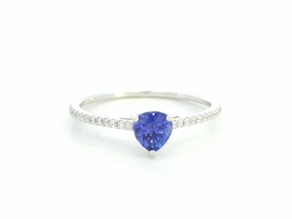 Pear-cut tanzanite ring in 18K white gold with pavé diamond band by Emirates Diamonds