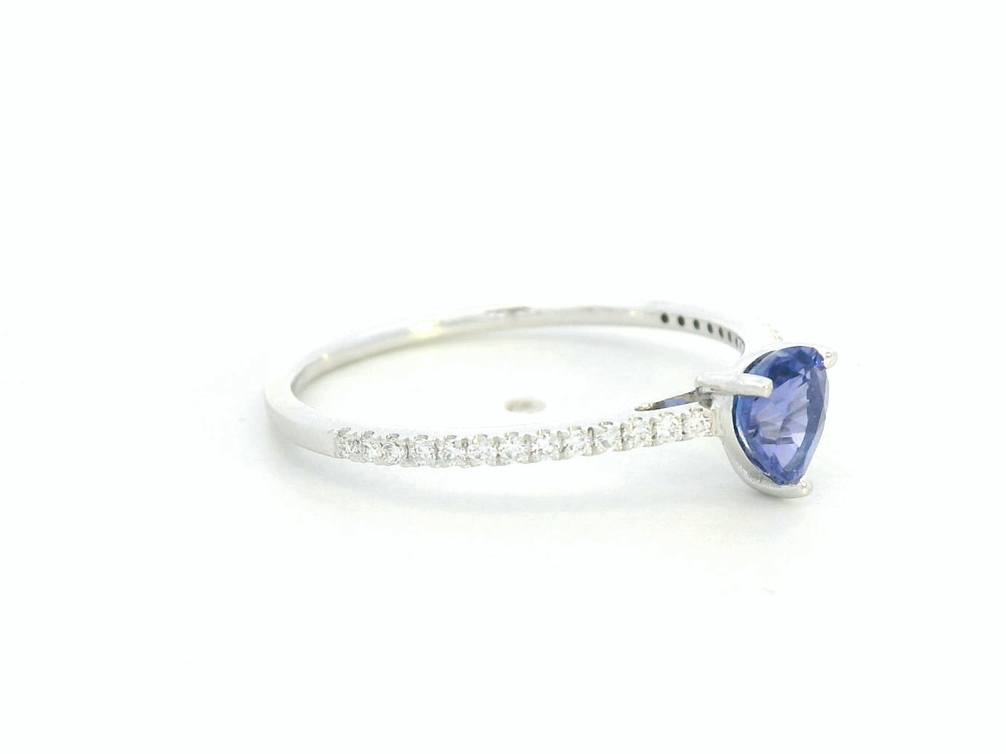 Pear-cut tanzanite ring in 18K white gold with pavé diamond band by Emirates Diamonds