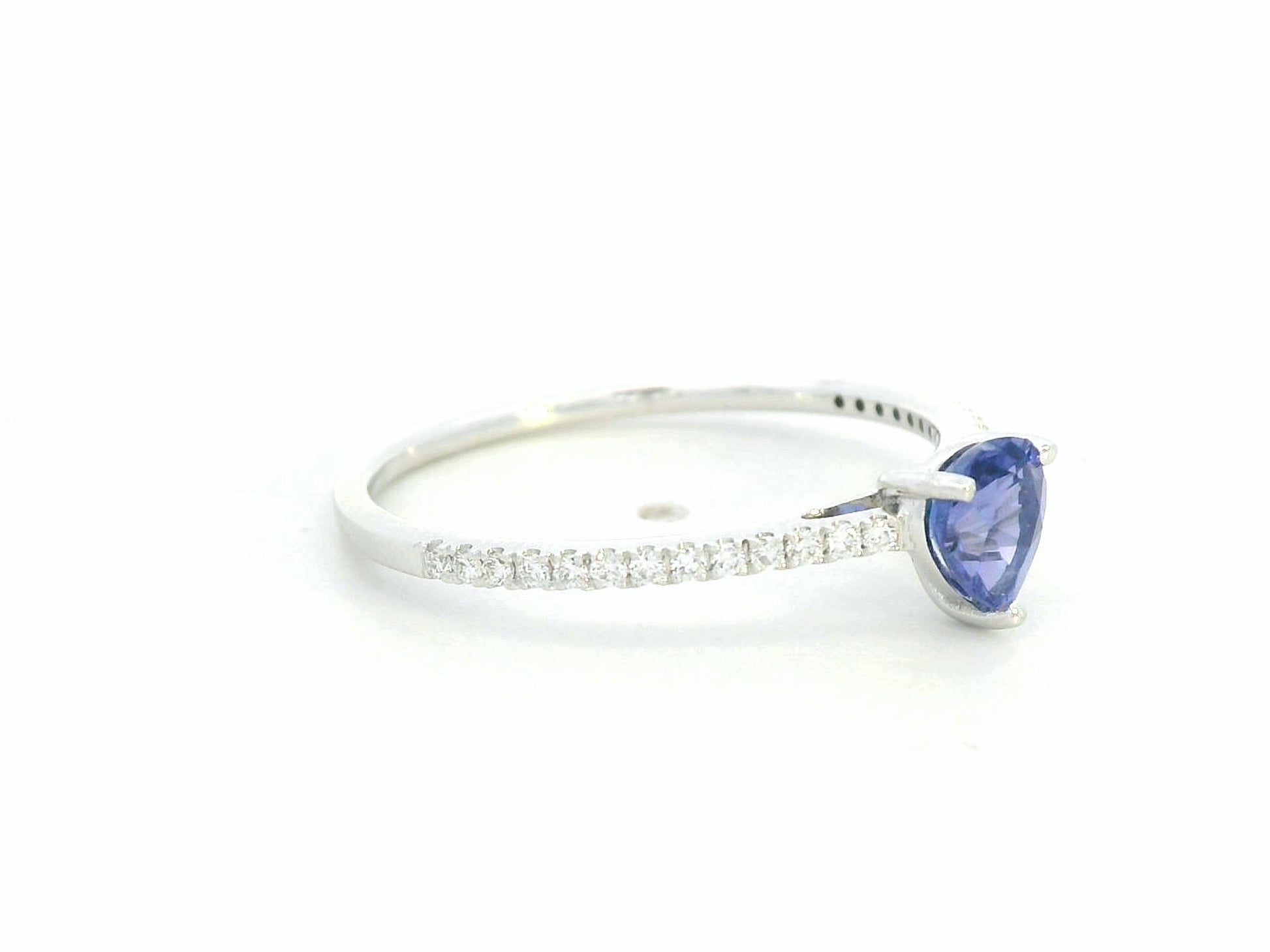 Pear-cut tanzanite ring in 18K white gold with pavé diamond band by Emirates Diamonds