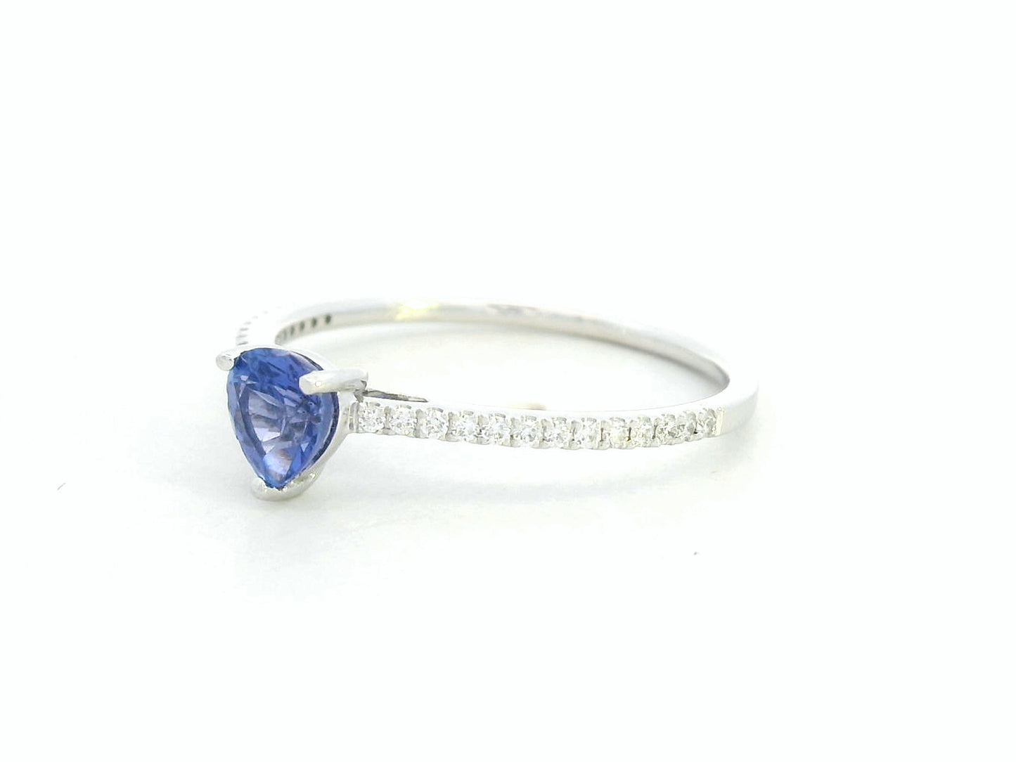 Pear-cut tanzanite ring in 18K white gold with pavé diamond band by Emirates Diamonds