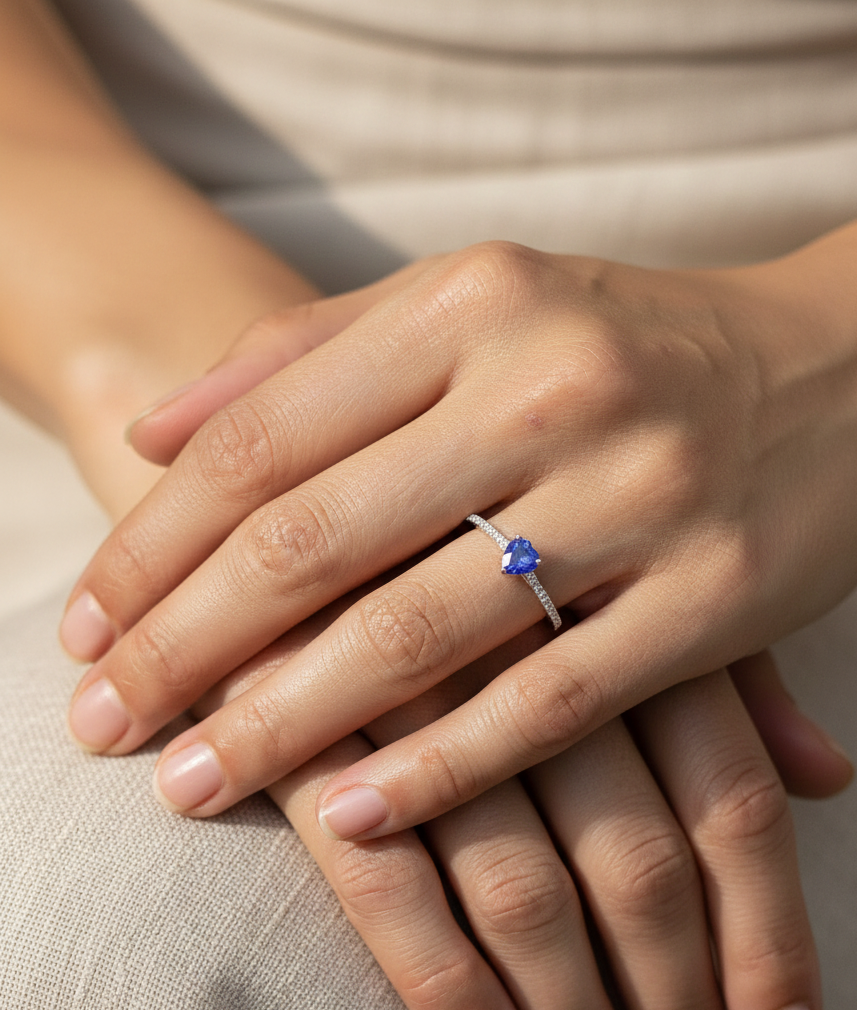 Pear-cut tanzanite ring in 18K white gold with pavé diamond band by Emirates Diamonds