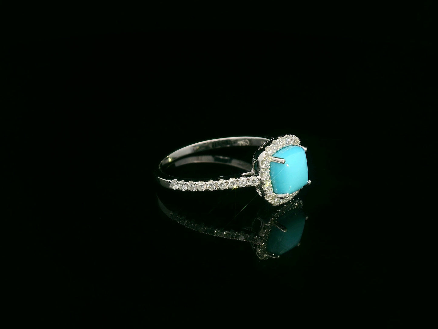 Turquoise and diamond halo ring in 18K white gold with cushion-cut turquoise by Emirates Diamonds