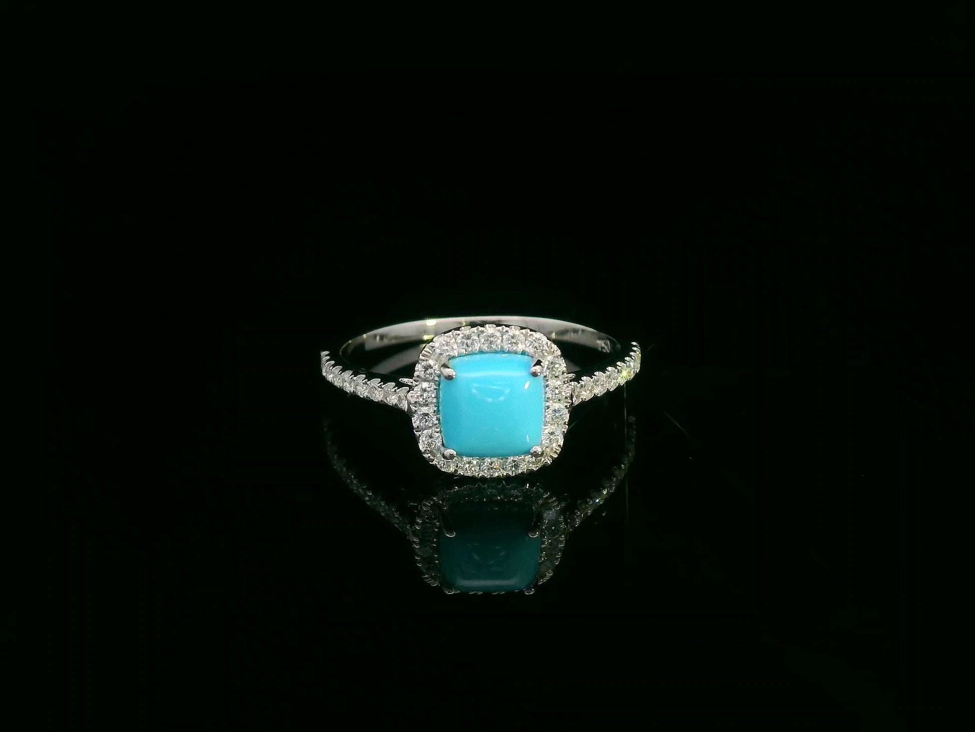 Turquoise and diamond halo ring in 18K white gold with cushion-cut turquoise by Emirates Diamonds
