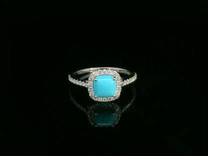 Turquoise and diamond halo ring in 18K white gold with cushion-cut turquoise by Emirates Diamonds