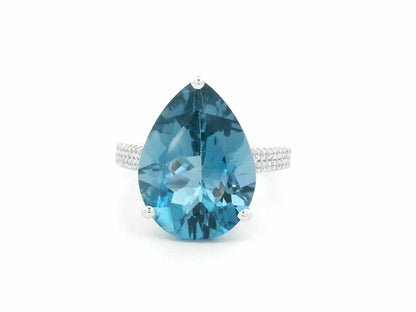 London blue topaz ring in 18K white gold with oval 9.07 carat gemstone and pavé diamond band by Emirates Diamonds