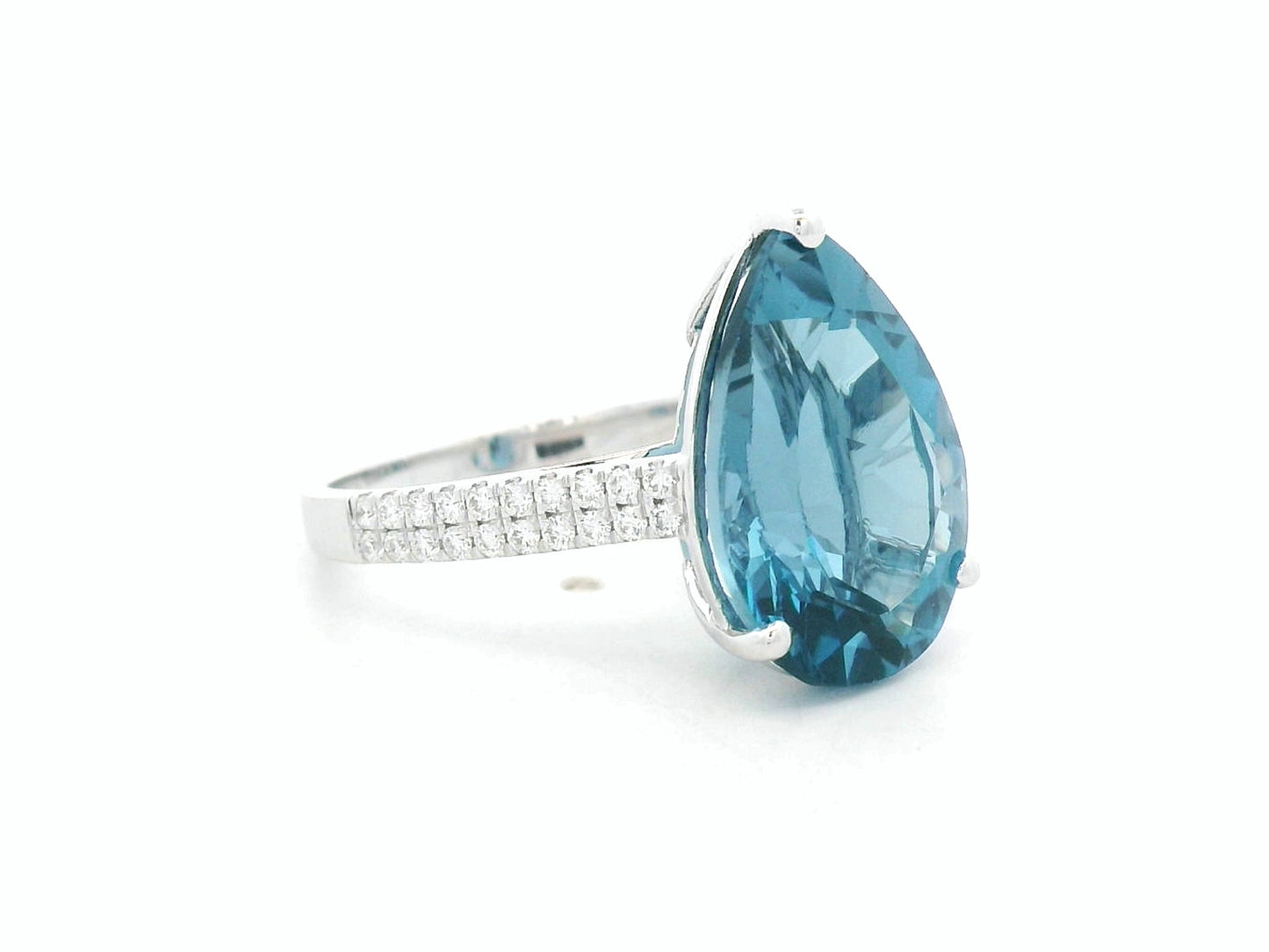 London blue topaz ring in 18K white gold with oval 9.07 carat gemstone and pavé diamond band by Emirates Diamonds