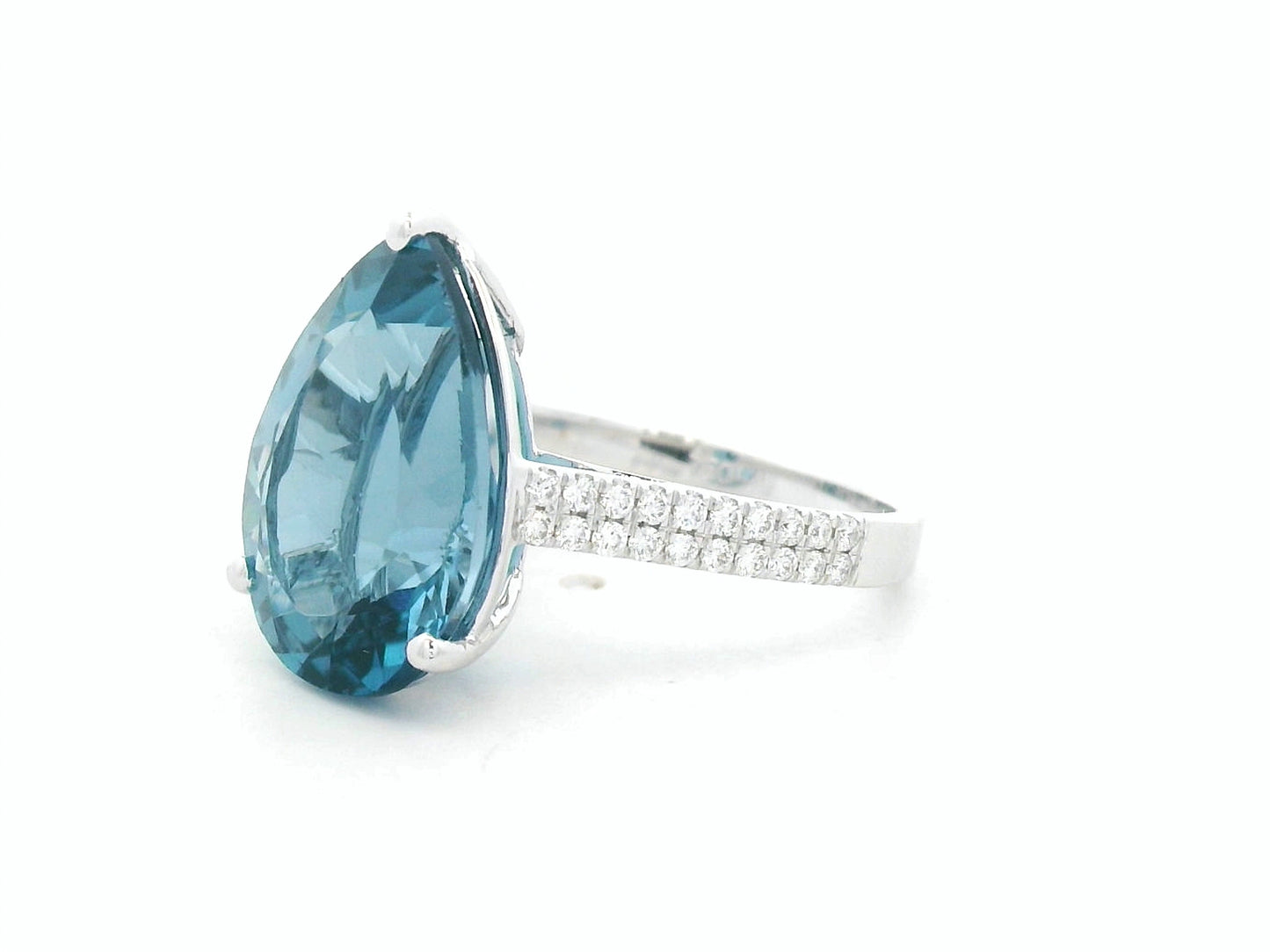London blue topaz ring in 18K white gold with oval 9.07 carat gemstone and pavé diamond band by Emirates Diamonds
