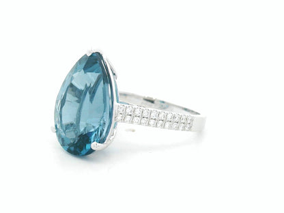 London blue topaz ring in 18K white gold with oval 9.07 carat gemstone and pavé diamond band by Emirates Diamonds