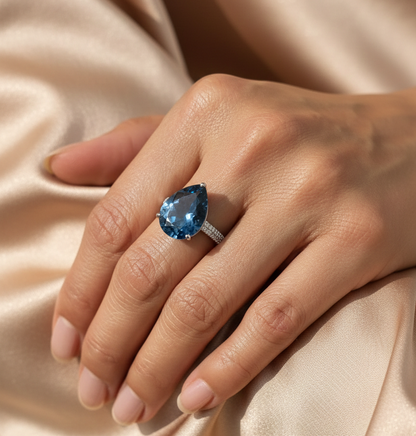 London blue topaz ring in 18K white gold with oval 9.07 carat gemstone and pavé diamond band by Emirates Diamonds