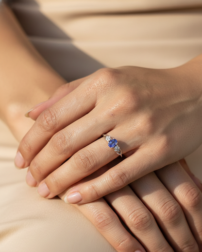 Oval tanzanite and diamond ring in 18K white gold with delicate side diamonds by Emirates Diamonds