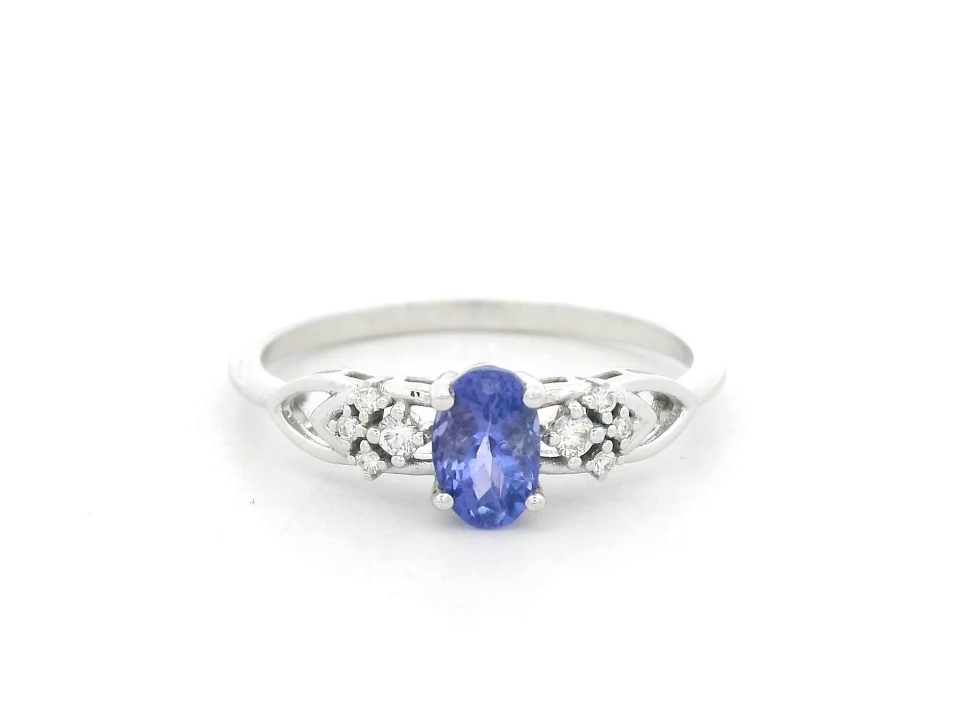Oval tanzanite and diamond ring in 18K white gold with delicate side diamonds by Emirates Diamonds