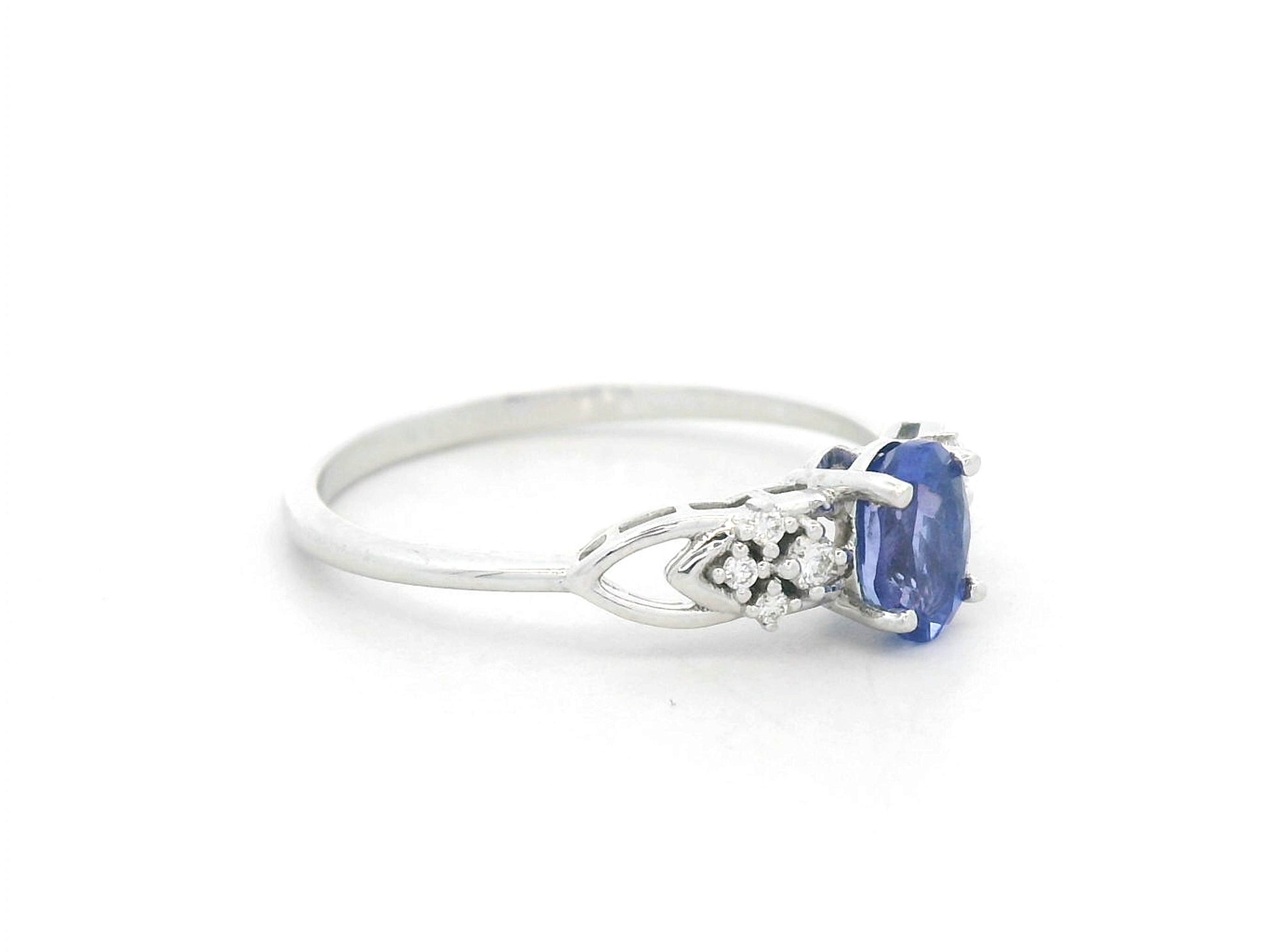 Oval tanzanite and diamond ring in 18K white gold with delicate side diamonds by Emirates Diamonds