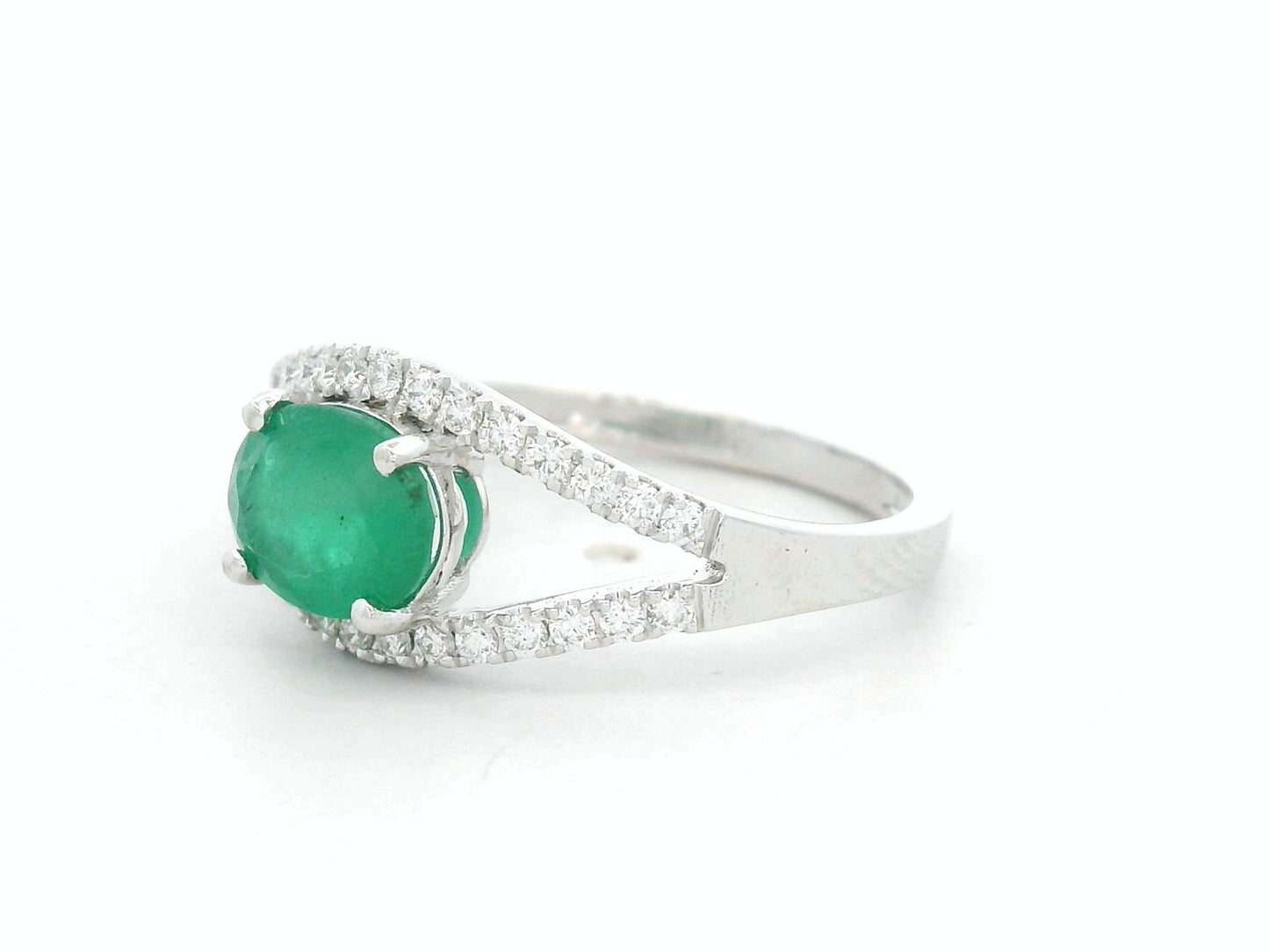 18K white gold emerald bypass ring with 0.98 carat emerald and 0.26 carat diamond accents by Emirates Diamonds