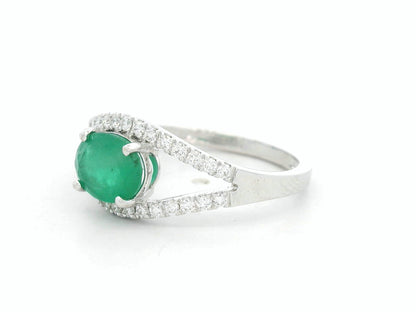 18K white gold emerald bypass ring with 0.98 carat emerald and 0.26 carat diamond accents by Emirates Diamonds