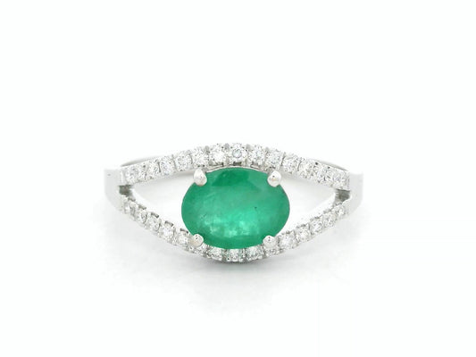18K white gold emerald bypass ring with 0.98 carat emerald and 0.26 carat diamond accents by Emirates Diamonds