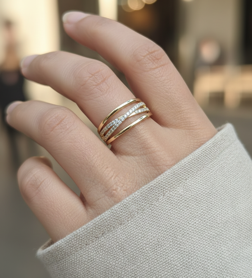 18K yellow gold diamond crossover ring with pavé-set diamonds by Emirates Diamonds