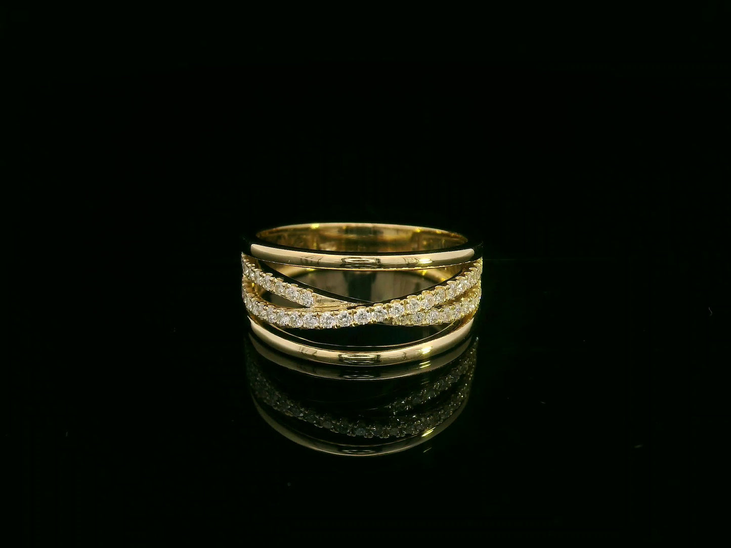 18K yellow gold diamond crossover ring with pavé-set diamonds by Emirates Diamonds