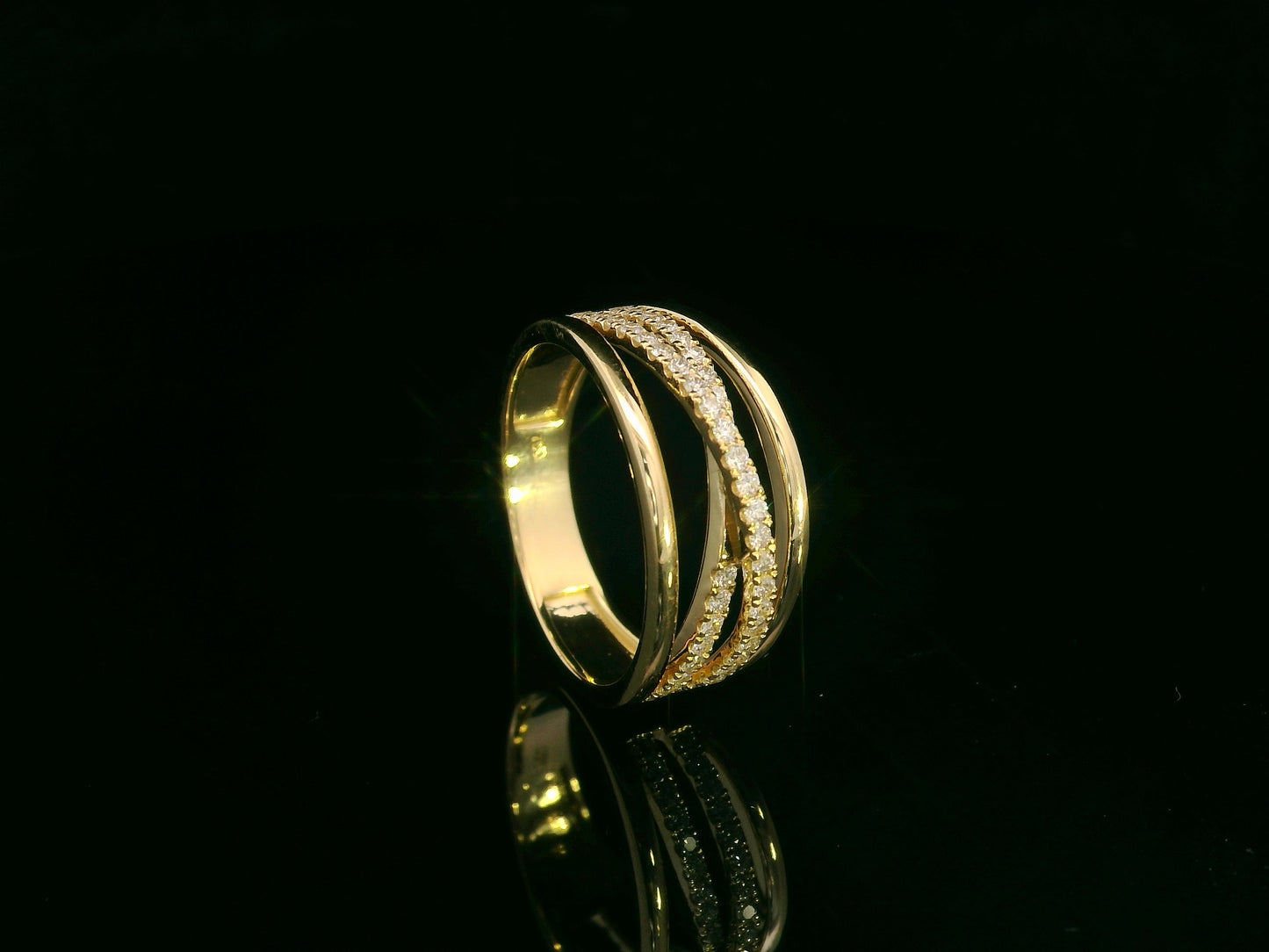 18K yellow gold diamond crossover ring with pavé-set diamonds by Emirates Diamonds