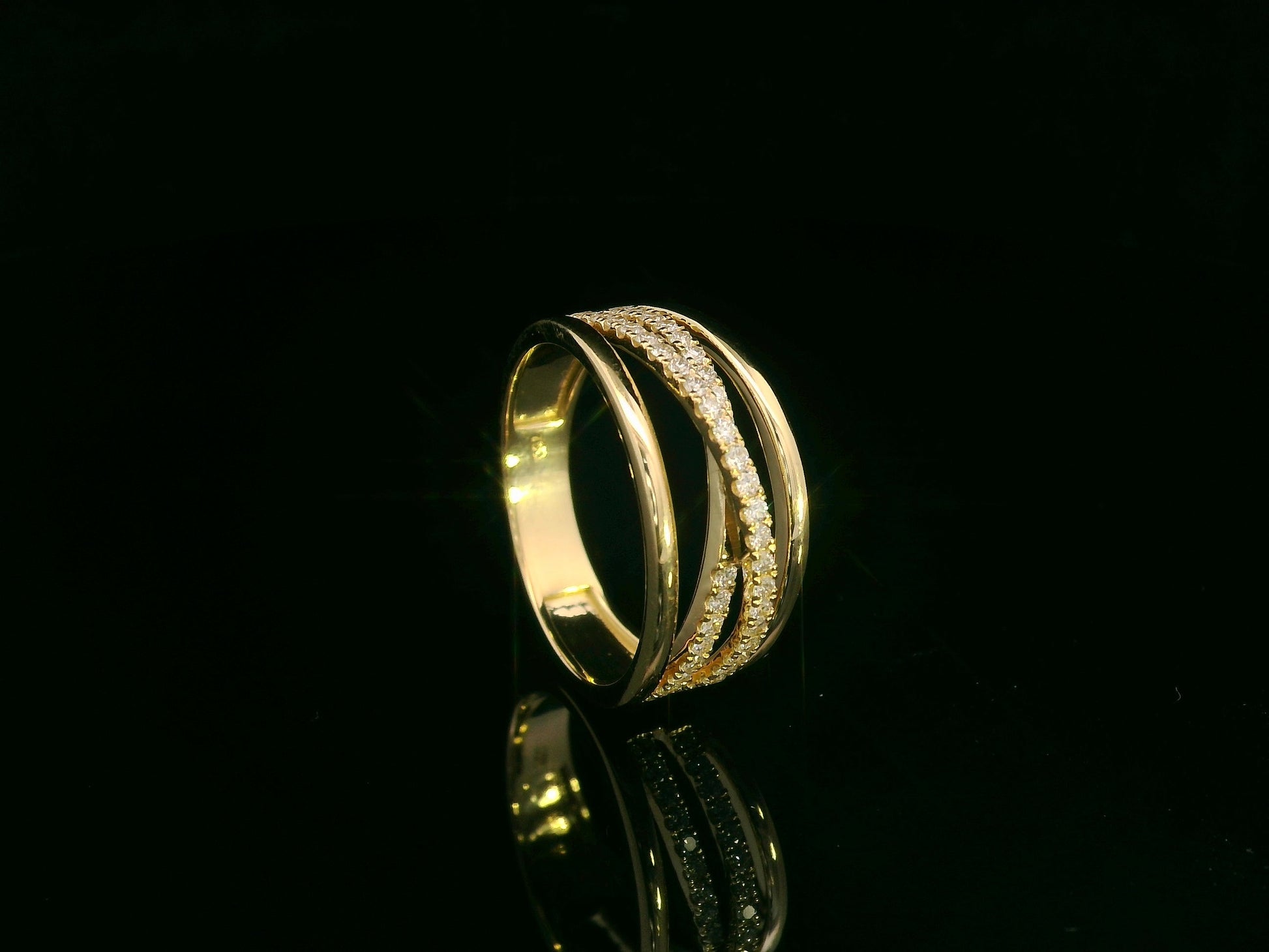 18K yellow gold diamond crossover ring with pavé-set diamonds by Emirates Diamonds