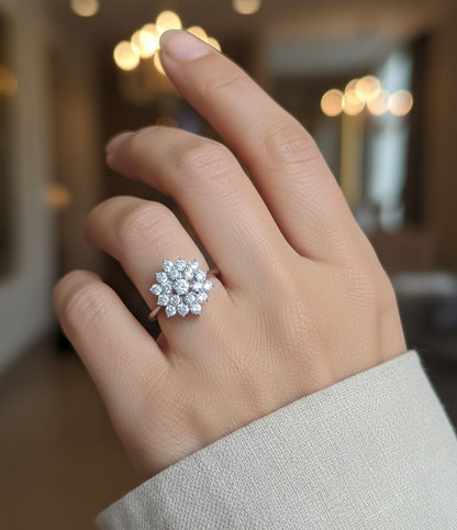 18K white gold diamond cluster ring with round brilliant diamonds in a floral-inspired setting by Emirates Diamonds