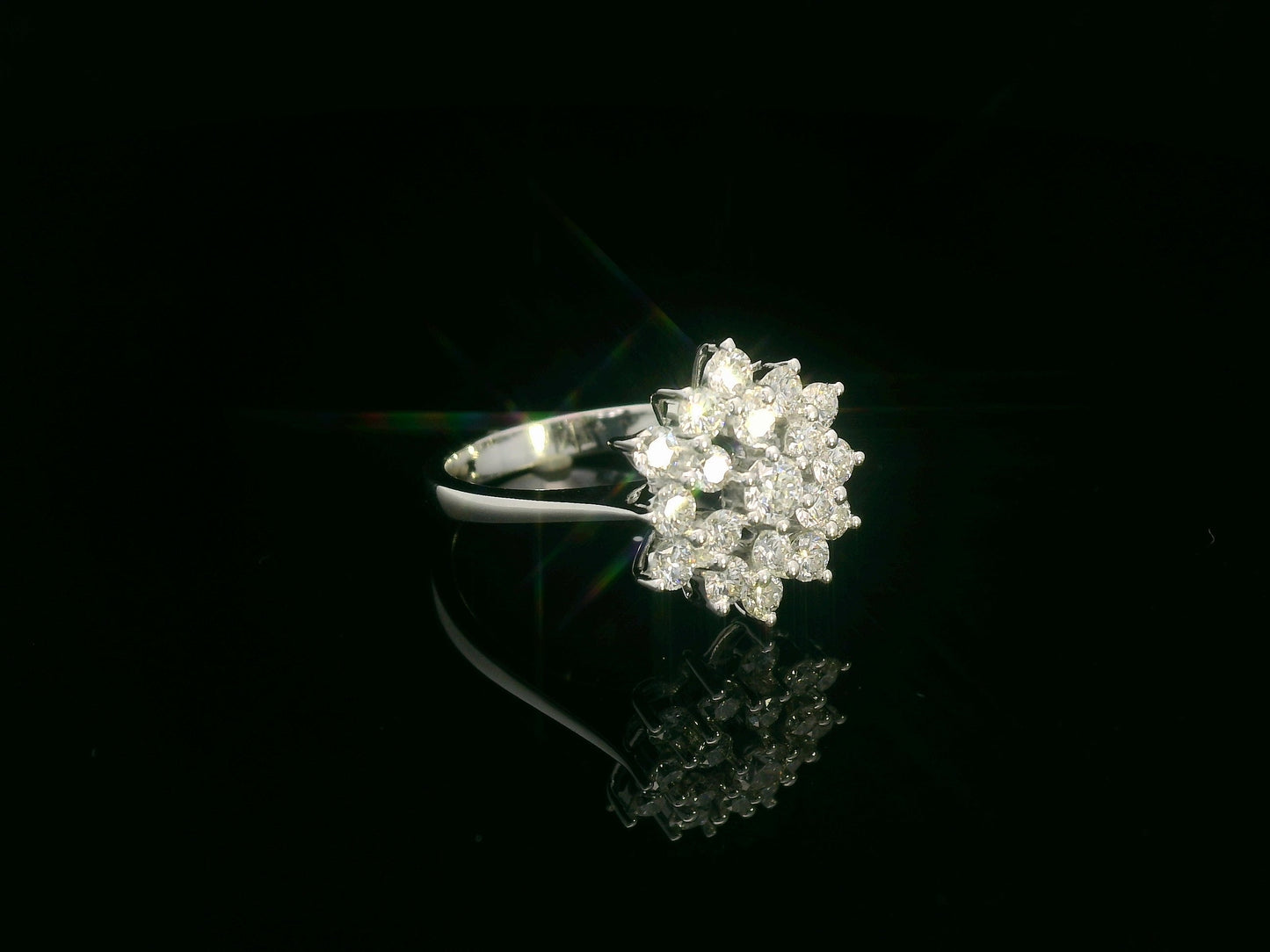 18K white gold diamond cluster ring with round brilliant diamonds in a floral-inspired setting by Emirates Diamonds