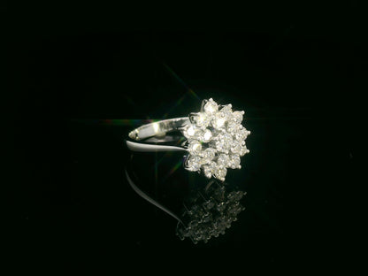 18K white gold diamond cluster ring with round brilliant diamonds in a floral-inspired setting by Emirates Diamonds