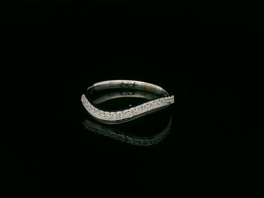 18K white gold curved diamond stacking band with pavé-set diamonds by Emirates Diamonds