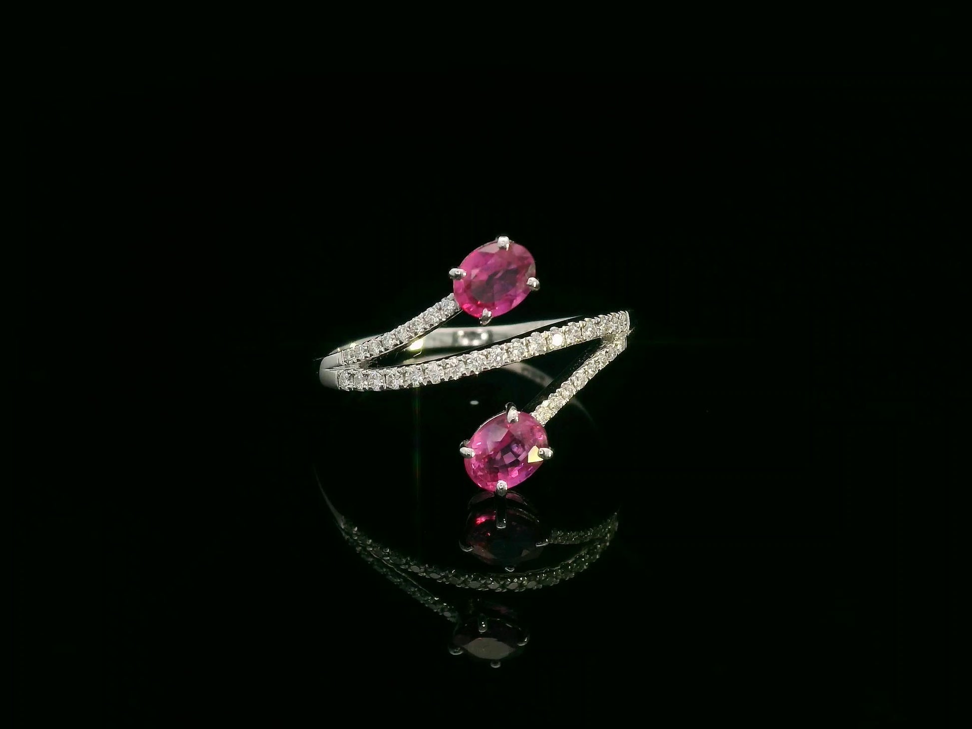 18K white gold ruby and diamond bypass ring with twin oval rubies by Emirates Diamonds