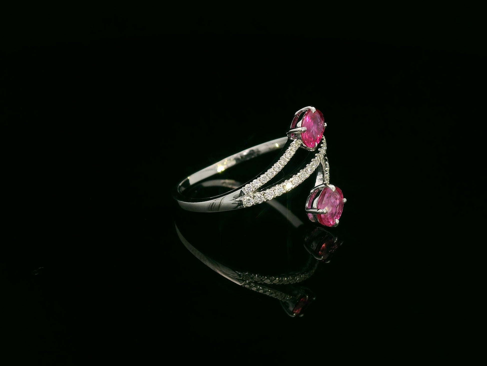 18K white gold ruby and diamond bypass ring with twin oval rubies by Emirates Diamonds