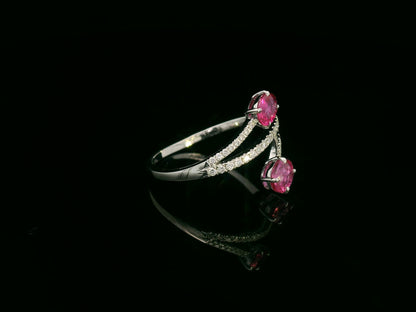 18K white gold ruby and diamond bypass ring with twin oval rubies by Emirates Diamonds