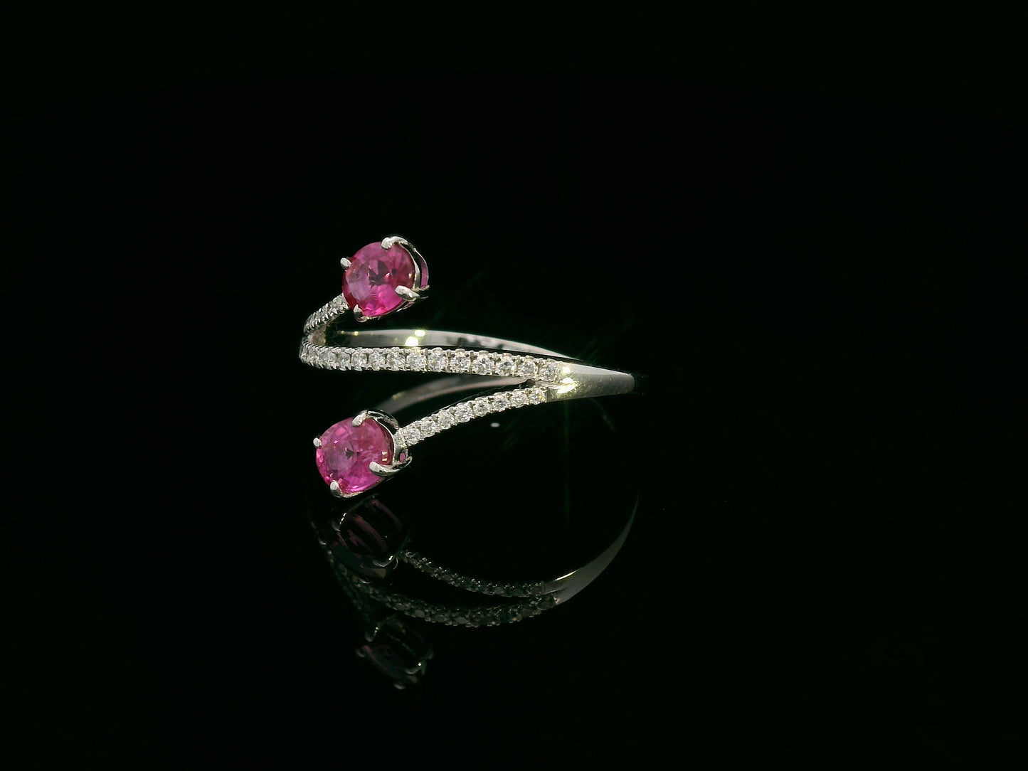 18K white gold ruby and diamond bypass ring with twin oval rubies by Emirates Diamonds