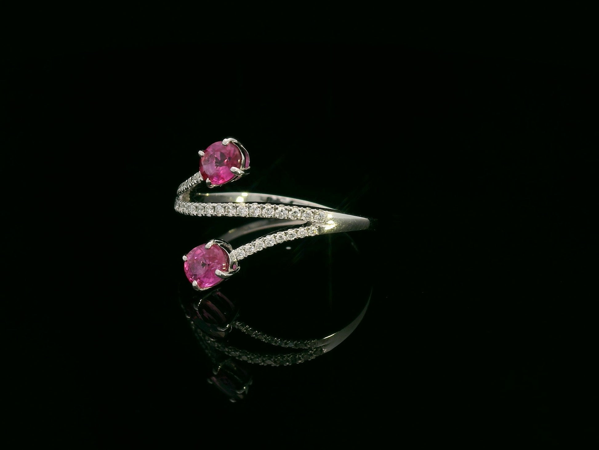 18K white gold ruby and diamond bypass ring with twin oval rubies by Emirates Diamonds