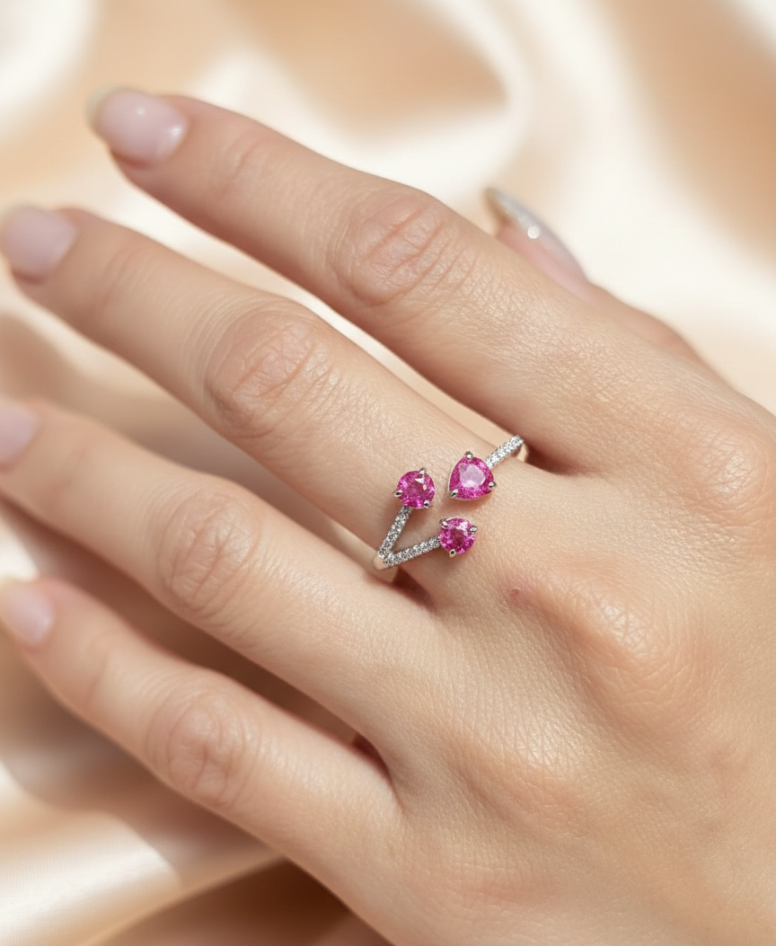 18K white gold open wrap ring with rubies and diamond accents by Emirates Diamonds