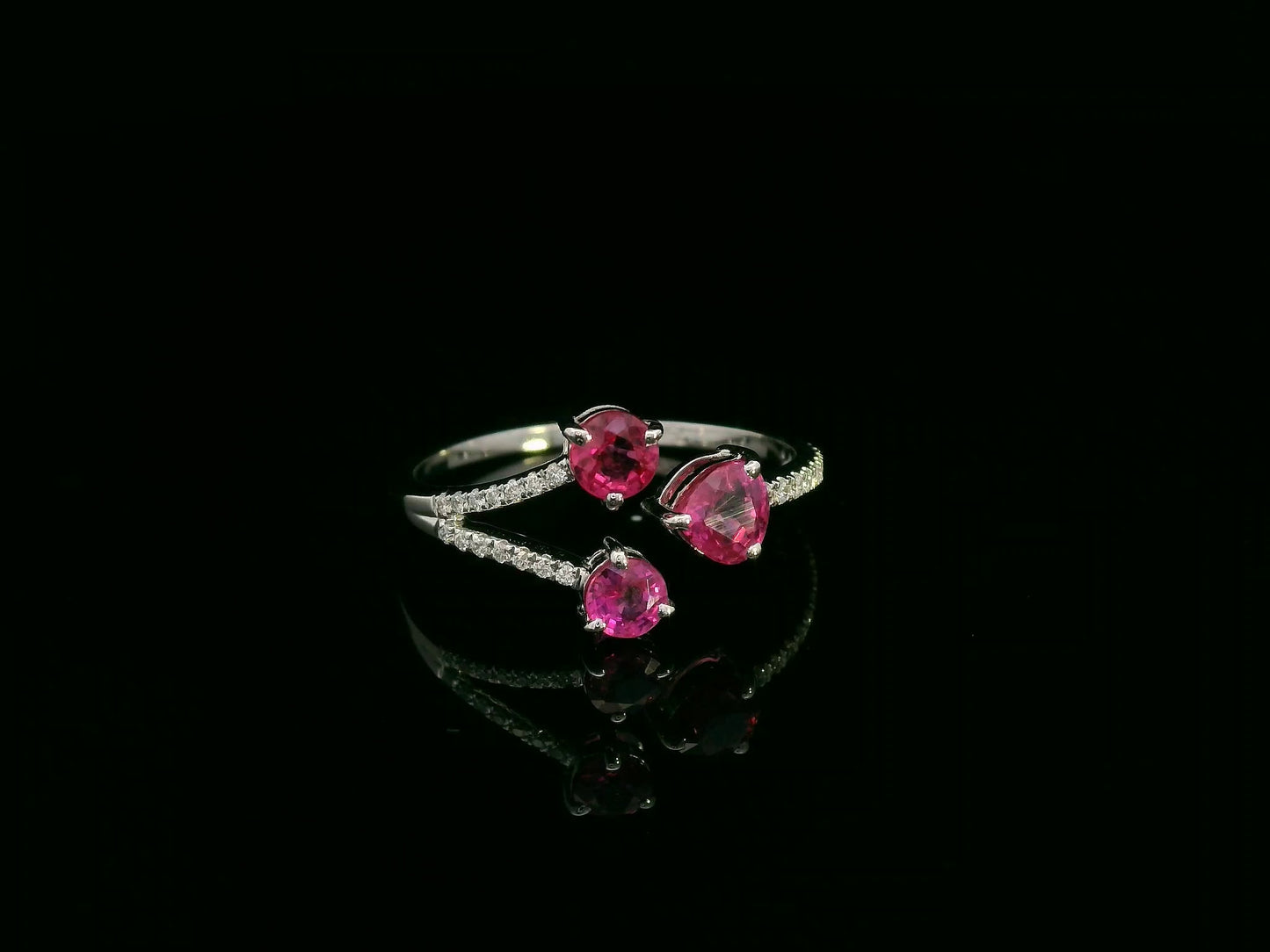 18K white gold open wrap ring with rubies and diamond accents by Emirates Diamonds