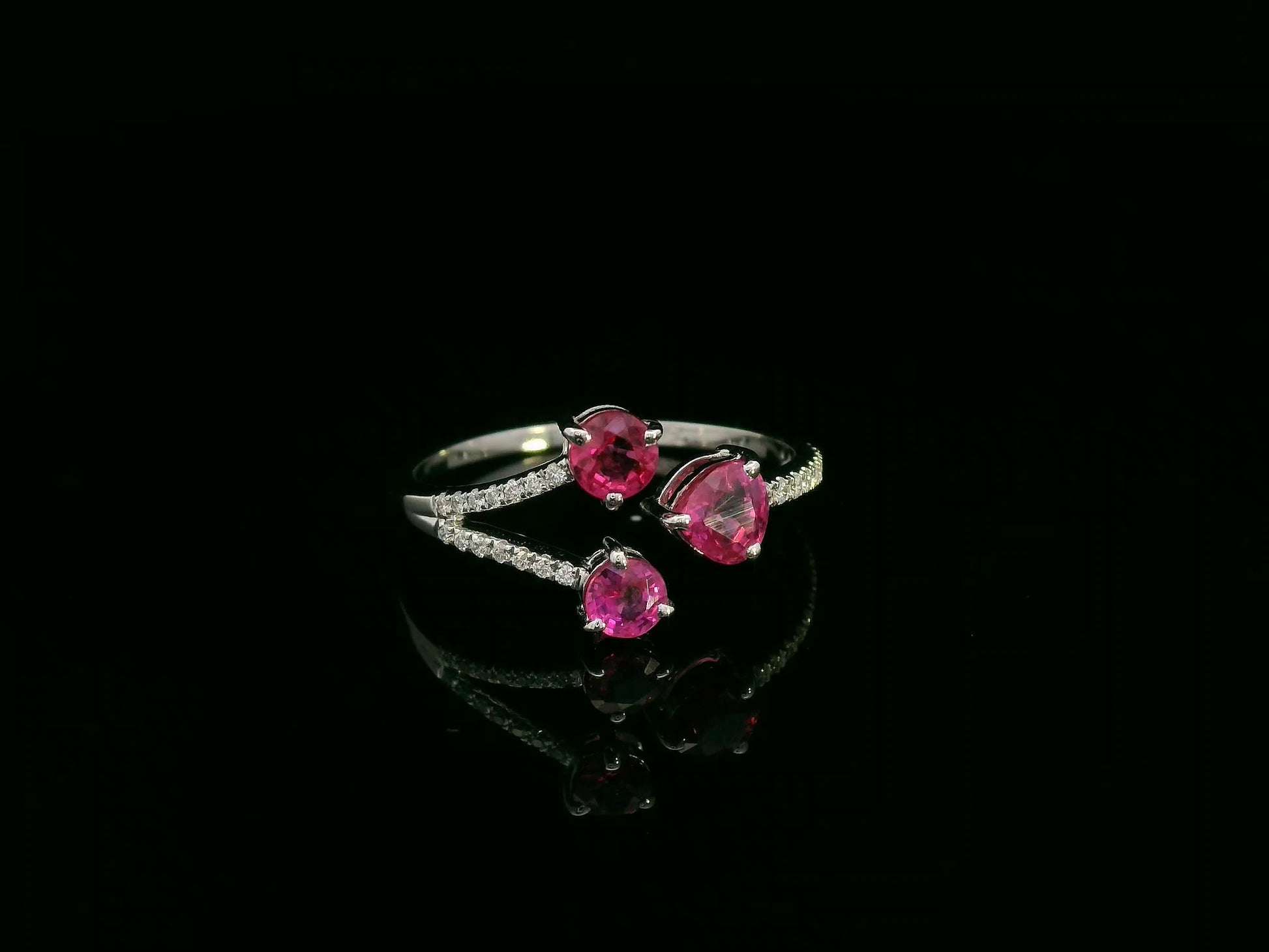 18K white gold open wrap ring with rubies and diamond accents by Emirates Diamonds