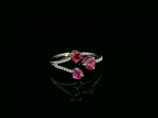 18K white gold open wrap ring with rubies and diamond accents by Emirates Diamonds