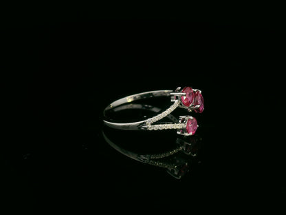 18K white gold open wrap ring with rubies and diamond accents by Emirates Diamonds