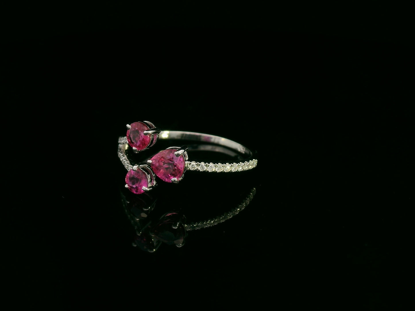18K white gold open wrap ring with rubies and diamond accents by Emirates Diamonds